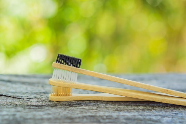 Zero waste concept Bamboo toothbrush on wooden background Plastic free essentials teeth care Sustainable lifestyle