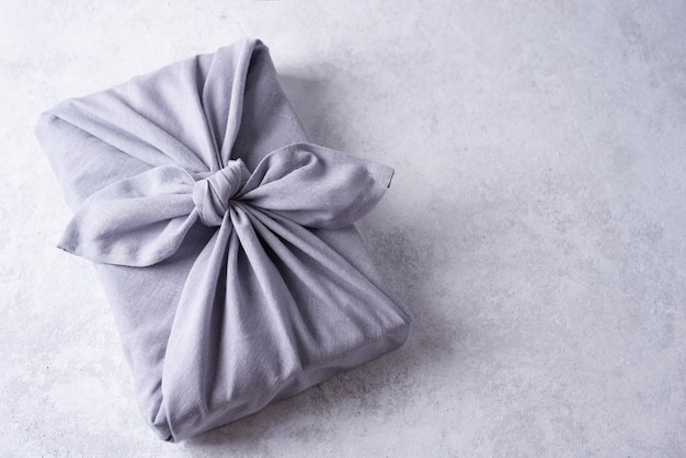 Zero waste concept, gift wrapping in reusable linen fabric.