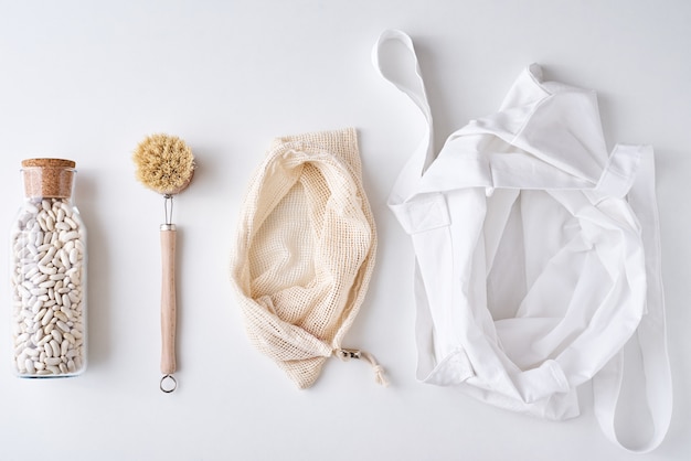 Zero waste concept. Multi-use bags and wooden brush