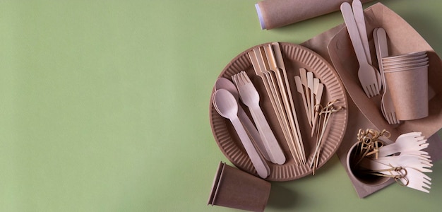 Zero waste environmentally friendly disposable wooden cardboard paper tableware View from above Copy space