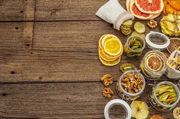 Zero waste food shopping concept. Assortment of dried fruits, walnuts. Sustainable lifestyle