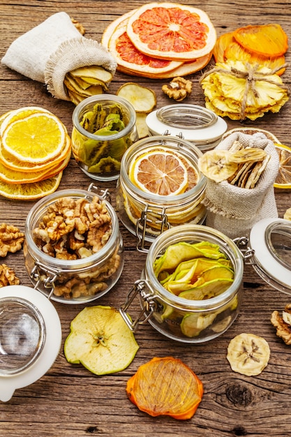 Zero waste food shopping concept. Assortment of dried fruits, walnuts. Sustainable lifestyle