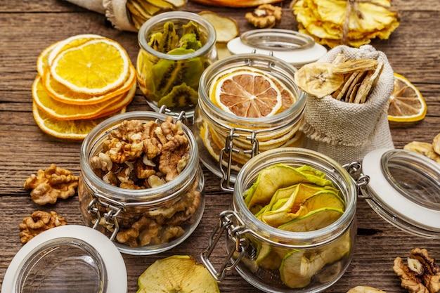 Zero waste food shopping concept. Assortment of dried fruits, walnuts. Sustainable lifestyle