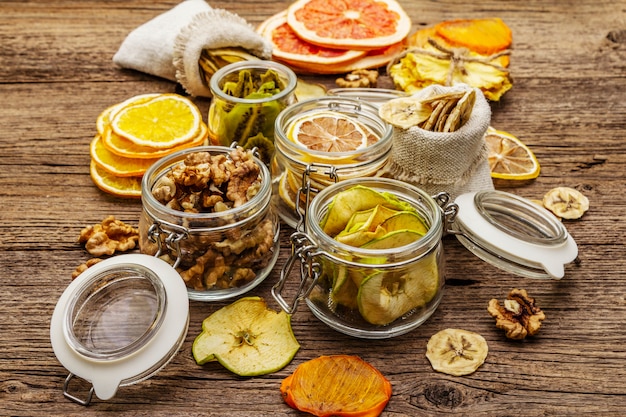 Zero waste food shopping concept. Assortment of dried fruits, walnuts. Sustainable lifestyle