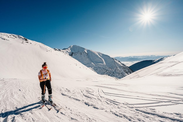 Ziarska dolina slovakia 1022022 Mountaineer backcountry ski walking ski alpinist in the mountains Ski touring in alpine landscape with snowy trees Adventure winter sport