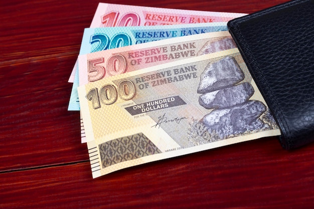 Zimbabwean money in the black walletx9