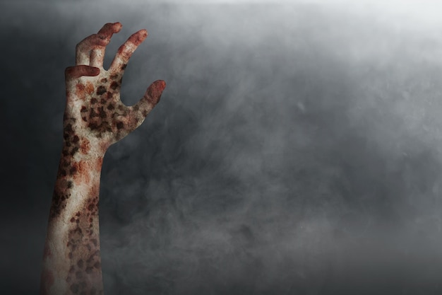 Zombie's hand with a dark background Scary Halloween concept