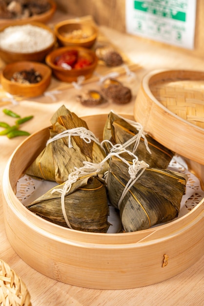 Zongzi or Bakcang is a traditional Chinese rice dish made of glutinous rice stuffed