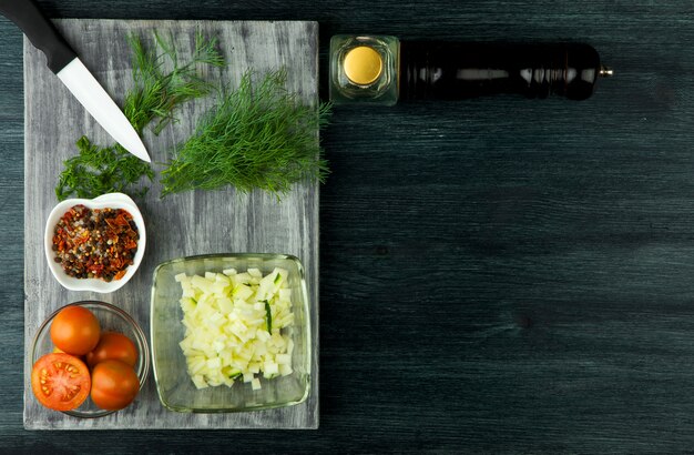 Zucchini in the background. Fried young sliced courgettes in a pan on a dark background. The view from the top. Copy space