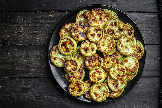 Zucchini grill fried vegetable BBQ fresh portion ready to eat meal snack on the table copy space