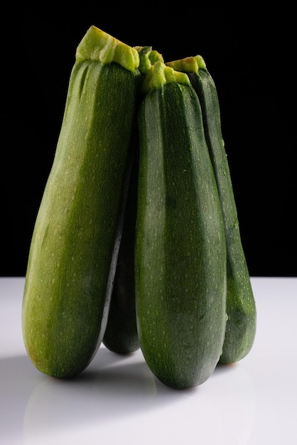 Zucchini zucchini on black and white background Minimalistic concept