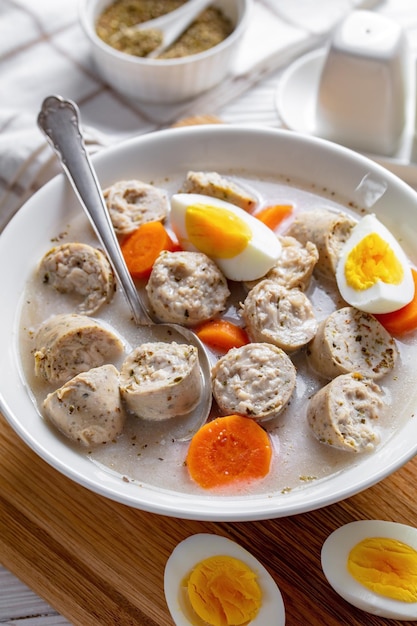 Zurek polish rye soup on a white wooden background