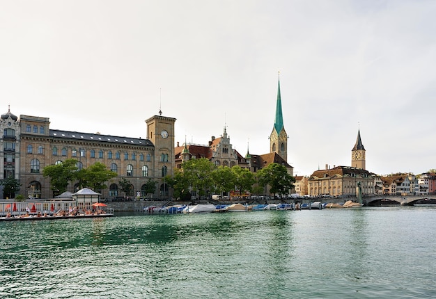 Zurich, Switzerland - September 2, 2016: St Peter Church and Fraumunster Church at Limmat River quay in the city center of Zurich, Switzerland.