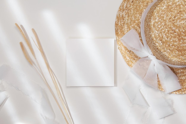 5x5 card mockup with straw hat on white background