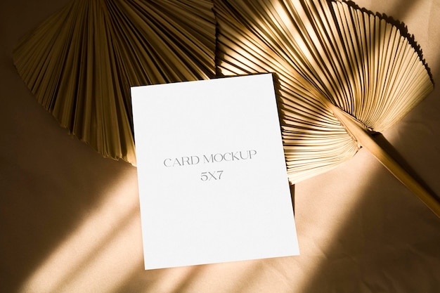 5x7 card mockup with sunlight shadows and dry palm leaf