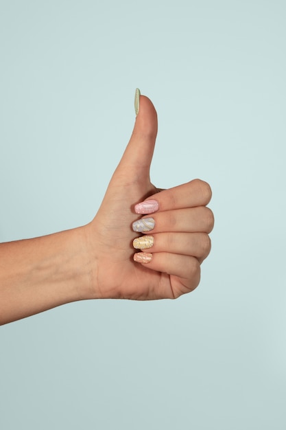 Adult woman hand with nail polish