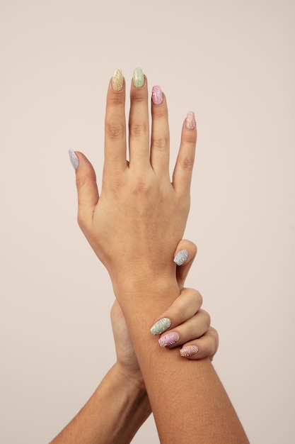 Adult woman hands with nail polish