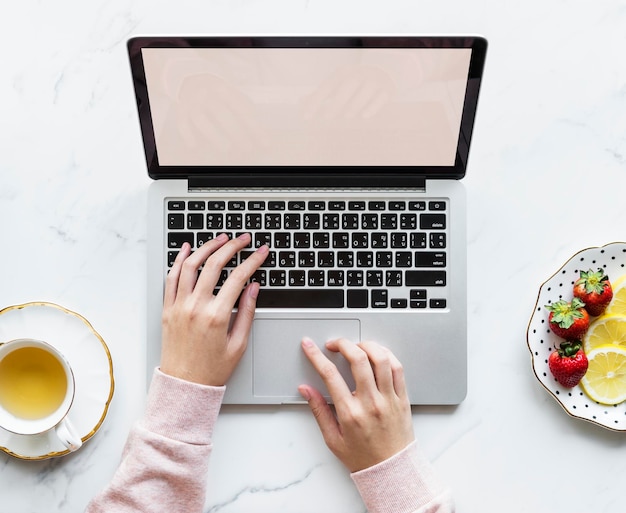 PSD aerial view of woman using a laptop