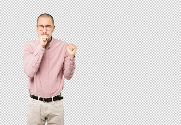 Angry young man posing isolated