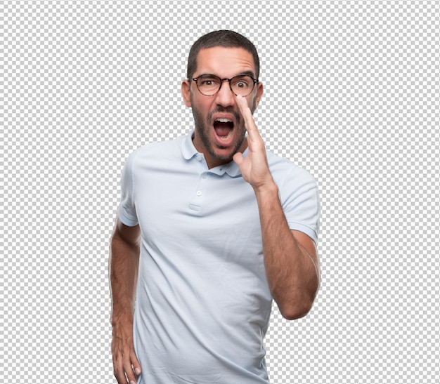 Angry young man using his hand to shout