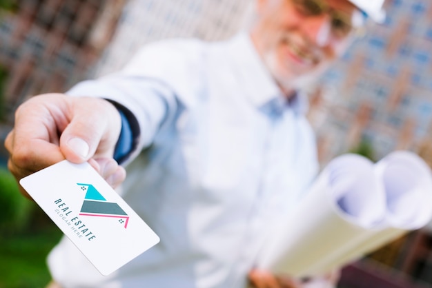 Architect handing a business card mock-up