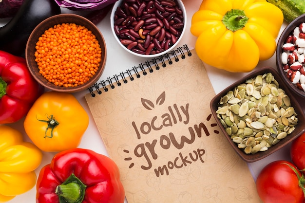 Arrangement of locally grown veggies mock-up and notepad