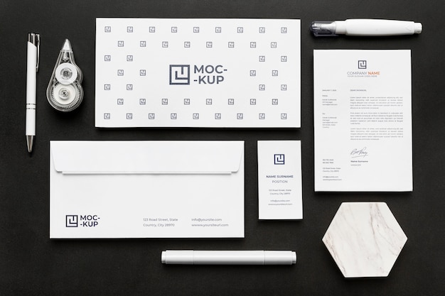 Arrangement of mock-up stationery on wood