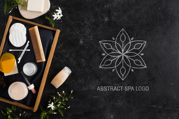 Arrangement with abstract spa salon logo