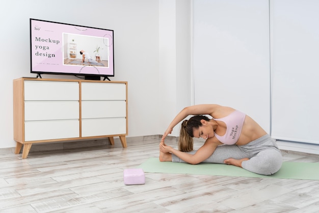 Athletic woman doing yoga at home