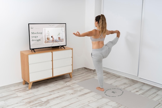 PSD athletic woman doing yoga at home