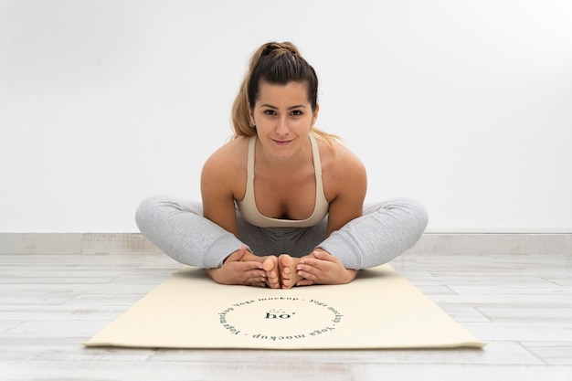 Athletic woman doing yoga at home