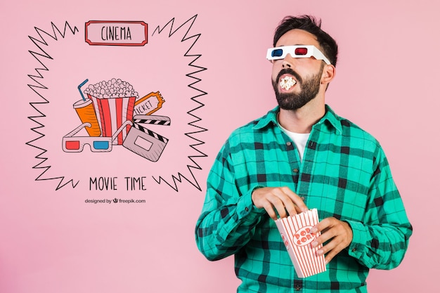 Bearded young man eating popcorn with 3 d  cinema glasses next to hand drawn cinema elements