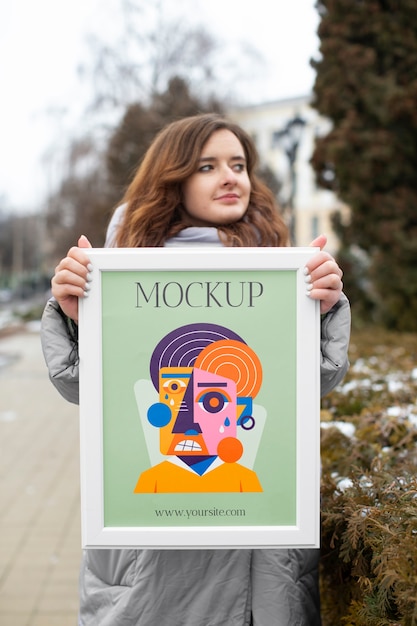 Beautiful frame model mockup held by girl