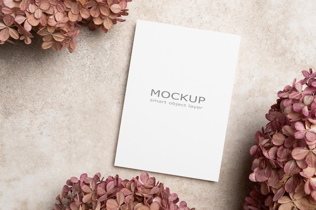 Beautiful paper card mockup with dry trendy flowers decor blank invitation or greeting card mock up