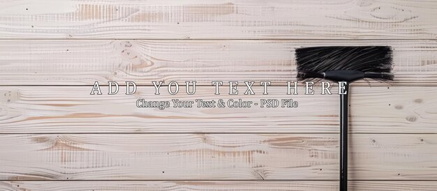 Black Broom on White Wood Plank Background