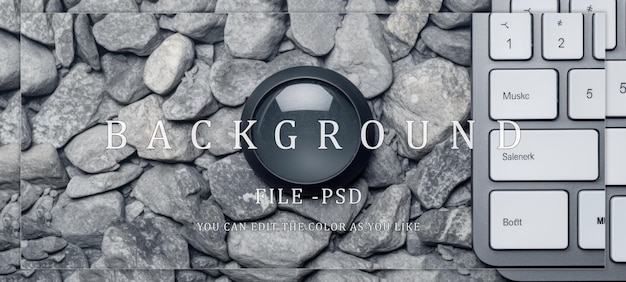 PSD black lens on a bed of grey stones