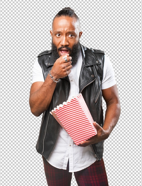 Black man eating popcorn