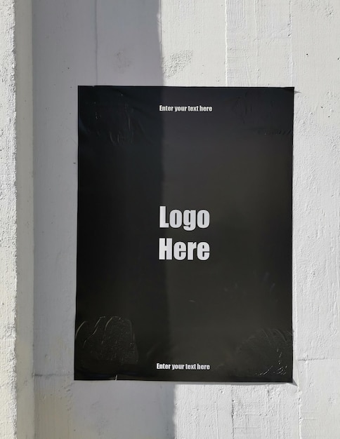 Black Poster on a wall_Mockup by 9ttwenty