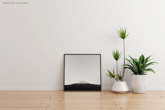 Black square photo frame mockup on white wall empty room with plants on a wooden floor