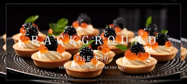 PSD blackberry and caviar tartlets on a black plate