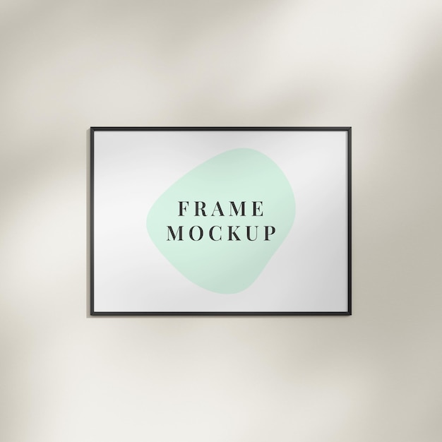 Blank frame on a wall with natural shadow