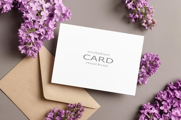 Blank invitation or greeting card mockup with fresh lilac flowers