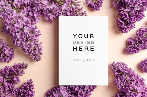 Blank invitation or greeting card mockup with purple lilac flowers