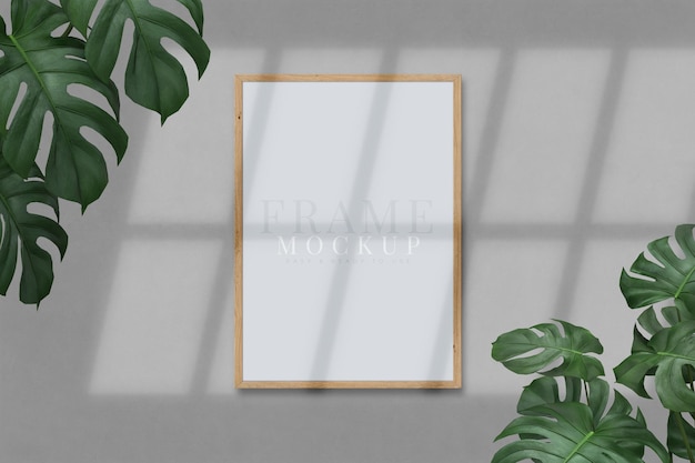 Blank picture frame for photographs art graphics with Leaves Frame mockup template on the background texture 3D rendering