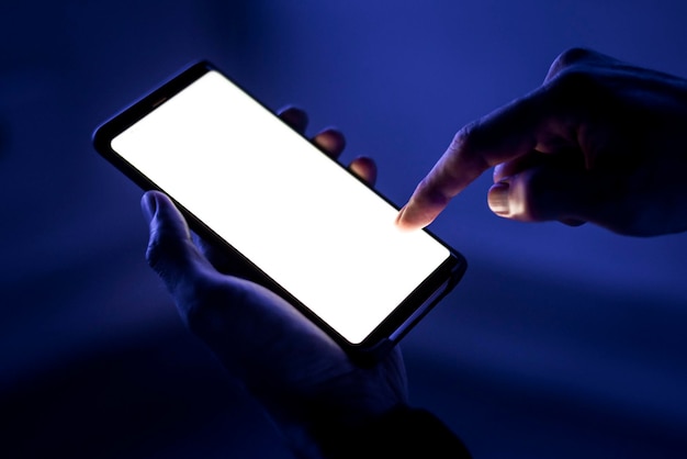 Blank smartphone screen mockup psd shining in the dark