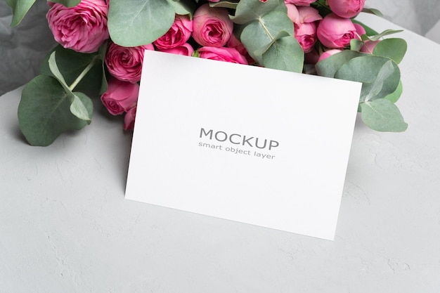 Blank wedding invitation card mockup with fresh flowers