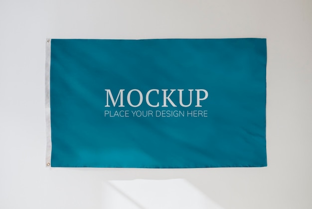 Blue flag mockup on a white wall