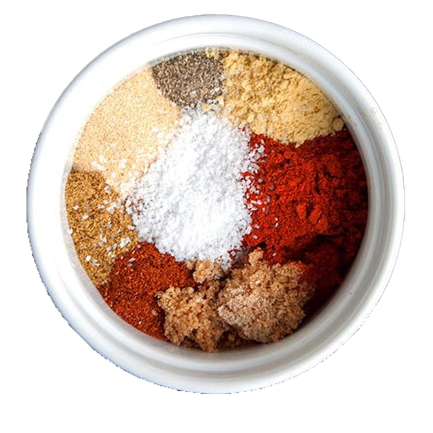 a bowl of spices with a white background with a red and white flag on the top