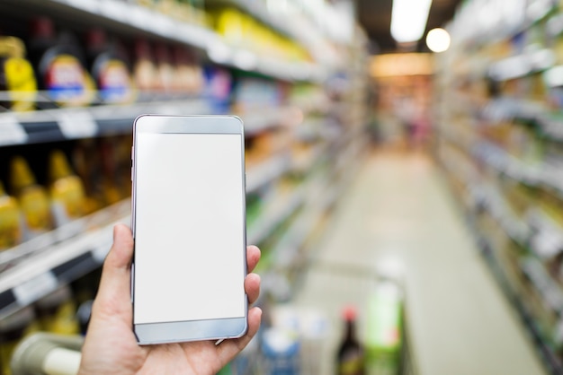 PSD browsing smartphone in supermarket 