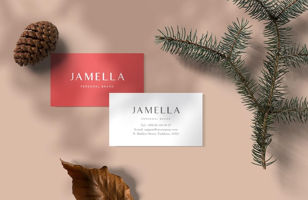 A business card for a christmas tree and a red card with the name jamia.